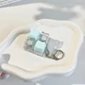 Detailed macro view of mechanical fidget keyboard keychain with cute cat-shaped keycaps - 4-Key Layout (Dual Sound) / Sea Salt Green