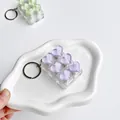 Detail shot of a 6-key decompression keychain with purple crystal heart buttons. - Six-Grid - Purple Heart Squishies
