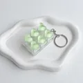 Ice transparent heart-shaped mechanical switch fidget keychain in pale green - Mint Green