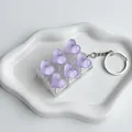 Six-grid keyboard fidget keychain with purple ice-transparent resin hearts - Purple