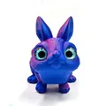 Macro view of a 3D printed rabbit figurine featuring iridescent blue and purple finish - Blue and Purple