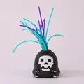 Giocattolo antistress piccolo mostro urlante con capelli in morbido silicone viola e ciano - Teschio / Nero