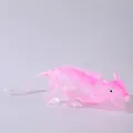 Detailed side view of a translucent pink and white dragon squeeze toy for stress relief - Pink