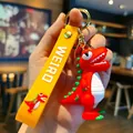 Süßer 3D-roter Cartoon-Dinosaurier-Schlüsselanhänger mit gelbem PVC-Band für Taschen - Starrender Dinosaurier / Rot