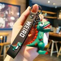 Süßer grüner Cartoon-Dinosaurier-Schlüsselanhänger aus weichem PVC mit schwarzem Band - Starrender Dinosaurier / Dunkelgrün