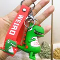 Mignon porte-clés dinosaure en PVC vert avec dragonne rouge WEIRD pour sac à dos - Dinosaure Tenant son Ventre / Vert clair