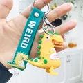 Porte-clés dinosaure de dessin animé jaune en PVC avec lanière verte lettrée WEIRD mignonne - Dinosaure Tenant son Ventre / Jaune