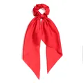 Elegant red satin scrunchie featuring a long streamer ribbon for stylish ponytail looks - Red