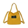 Minimalist Japanese style yellow canvas bucket bag with shoulder strap and top handles - Yellow