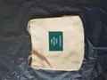 Minimalist Japanese style beige canvas bucket bag featuring a green letter patch - Khaki