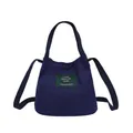 Minimalist navy blue canvas bucket bag featuring a crossbody strap and top handles - Dark Blue