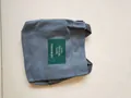 Minimalist grey canvas small bucket bag with green Living Traveling Share patch - Dark Gray