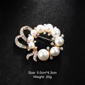 Elegant gold-plated pearl and crystal wreath brooch pin for formal suits and dresses. - Artificial Pearl Bow Half Ring Style (XD8794) / Gold