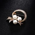 Elegant gold pearl brooch with rhinestones for wedding suits and dress accessories - Artificial Pearl Ring Bow Style (XD7887) / Gold