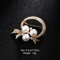 Elegant gold pearl brooch with rhinestones for wedding suits and dress accessories - Artificial Pearl Ring Bow Style (XD7887) / Gold