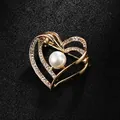 Elegant heart-shaped brooch with central pearl and rhinestone accents in gold finish - Double Heart Style (XD9140) / Gold