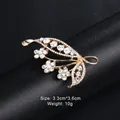 Elegant golden leaf brooch adorned with sparkling clear rhinestones for suit or dress - Leaf and Floral Spray Style (XD9146) / Gold