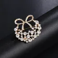 Elegant golden rhinestone bow wreath brooch accessory for suits and formal dresses - Bowknot Ring Style (XD9131) / Gold