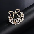 Elegant golden rhinestone bow wreath brooch accessory for suits and formal dresses - Bowknot Ring Style (XD9131) / Gold