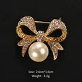 Elegant gold-tone bow brooch pin featuring sparkling rhinestones and a large pearl pendant - Golden Bowknot Hanging Pearl Style (XD6408-1)
