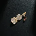 Elegant gold violin brooch with clear rhinestones and purple musical note pendant charm. - Violin and Music Note Style (XD7981) / Gold