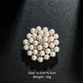 Elegant flower brooch featuring white pearls and sparkling rhinestones on a gold base - Artificial Pearl Floral Style (XD973) / Gold