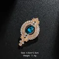 Vintage gold-tone oval brooch with large blue gemstone and sparkling rhinestones - Vintage Oval Gem Style (XD9080) / Gold