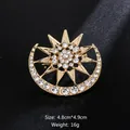 Elegant gold-toned sun and moon brooch encrusted with sparkling clear rhinestones - Star and Moon Style (XD9268) / Gold