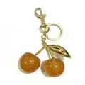Amber resin cherry keychain bag charm with gold glitter and metallic finish - 3cm / Transparent Yellow Gold Rod