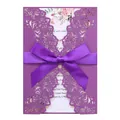 Detailed view of a purple laser-cut wedding invitation card with an elegant ribbon bow. - Deep purple
