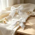 Two elegant white satin ribbon bow hair clips featuring a classic double-layered design - Double Layer Satin Bow / 2 Pcs/Set / White
