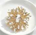Élégante broche en cristal en forme de soleil avec une grande pierre ovale dorée - Or