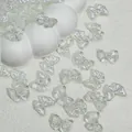 Detail view of 14x10mm translucent glass bow beads for DIY jewelry making and crafts - Bowtie (L811#) / 14x10mm / White