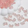 Macro detail of transparent pink bow-shaped glass beads for jewelry making - Bowtie (L813#) / 14x10mm / Peach Pink