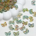 Macro view of iridescent glass bow beads for DIY jewelry making 14x10mm - Dawn Color