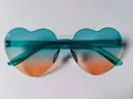 Rimless heart-shaped sunglasses featuring a vibrant teal and orange gradient jelly tint - Lake Blue to Orange Gradient
