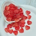 Detailed macro view of red translucent heart-shaped glass beads with textured surface - L628# Red