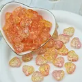 Detailed macro shot of orange heart-shaped glass beads with unique texture for DIY jewelry - L629# Orange Pink