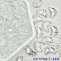 Macro detail of crescent moon-shaped clear glass beads for DIY jewelry crafts, 10x14x5mm - Clear White