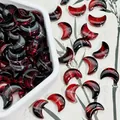 Macro detail of red moon-shaped glass beads, measuring 10x14x5mm for DIY crafts - Black Red