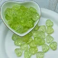Macro view of textured 14x16mm translucent green heart-shaped glass beads for DIY crafts - L639# Light Green