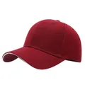 Detailed close-up of a maroon baseball cap with a subtle white trim on the brim edge. - One Size Adjustable / Wine Red & White