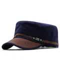 Detailed view of a navy blue military cadet cap with brown leather brim and star emblem. - Adjustable / Navy Blue