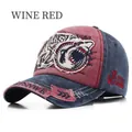 Macro view of washed baseball cap featuring shark embroidery and wine red color detail - Adjustable / Burgundy