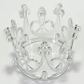 Macro detail of a silver alloy mini crown with white pearl accents for cake or hair decor - Silver