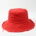 Detailed view of red canvas bucket hat with frayed edges and wide brim for sun protection. - 58cm (Brim with Aluminum Wire for Shaping) / Orange Red