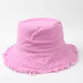Close-up detail of a stylish pink bucket hat featuring a trendy frayed edge brim design - 58cm (Brim with Aluminum Wire for Shaping) / Rose Pink