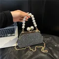 Elegant rhinestone evening bag with large pearl handle and gold chain strap - S / Black and Silver