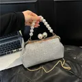 Elegant silver rhinestone evening clutch bag with large pearl handle and gold chain strap - L / Silver