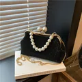 Elegant black evening clutch with pearl handle and gold chain strap for luxury parties - L / Black
